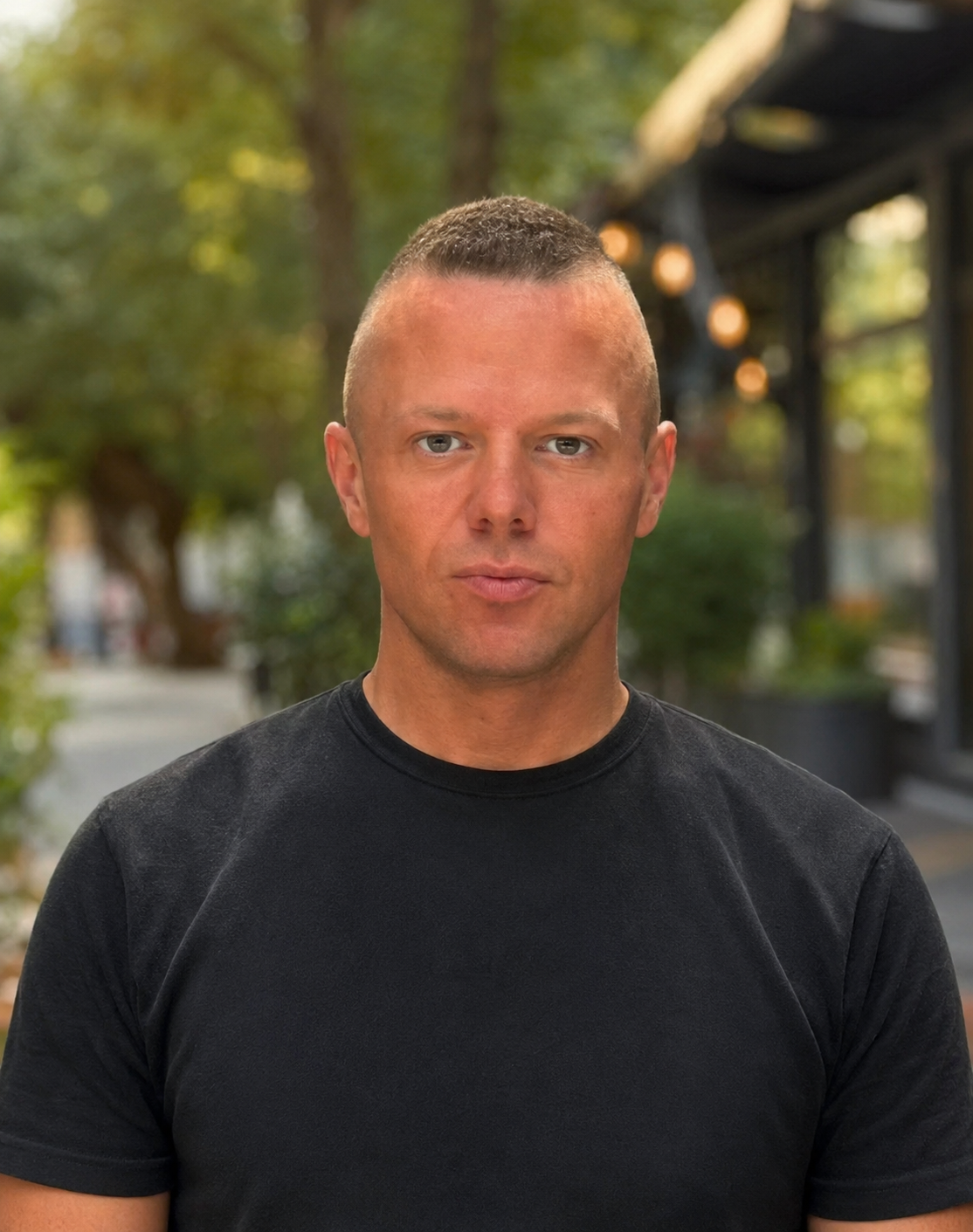 Portrait of Evan outdoors in a black t-shirt
